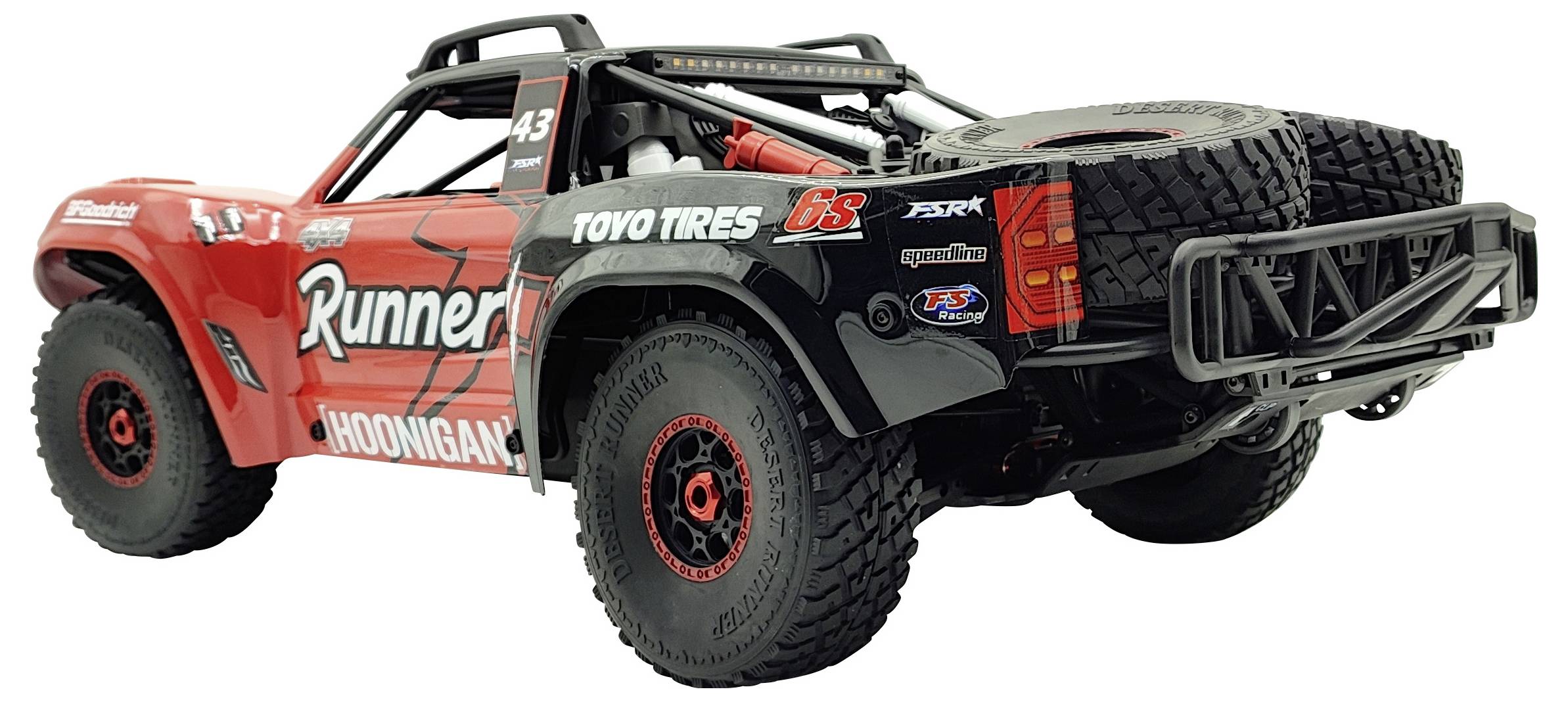 A remote-controlled model car with wide tyres and a spare tyre on the back. The design is sporty with 'Runner' lettering.