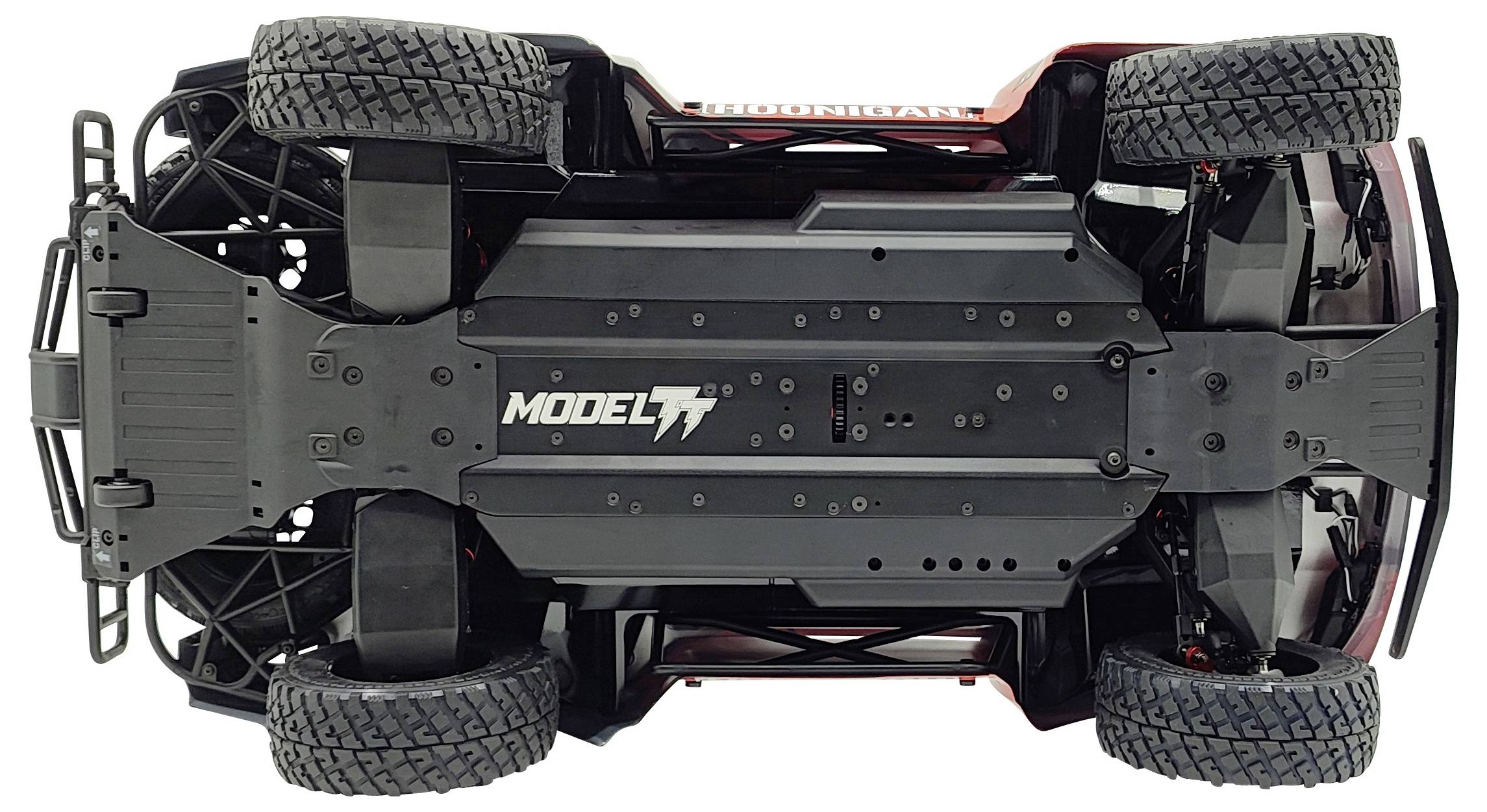 Toy car viewed from underneath, showing the mechanics and structure with four wheels. "Model 7" is written in large lettering on the underside.