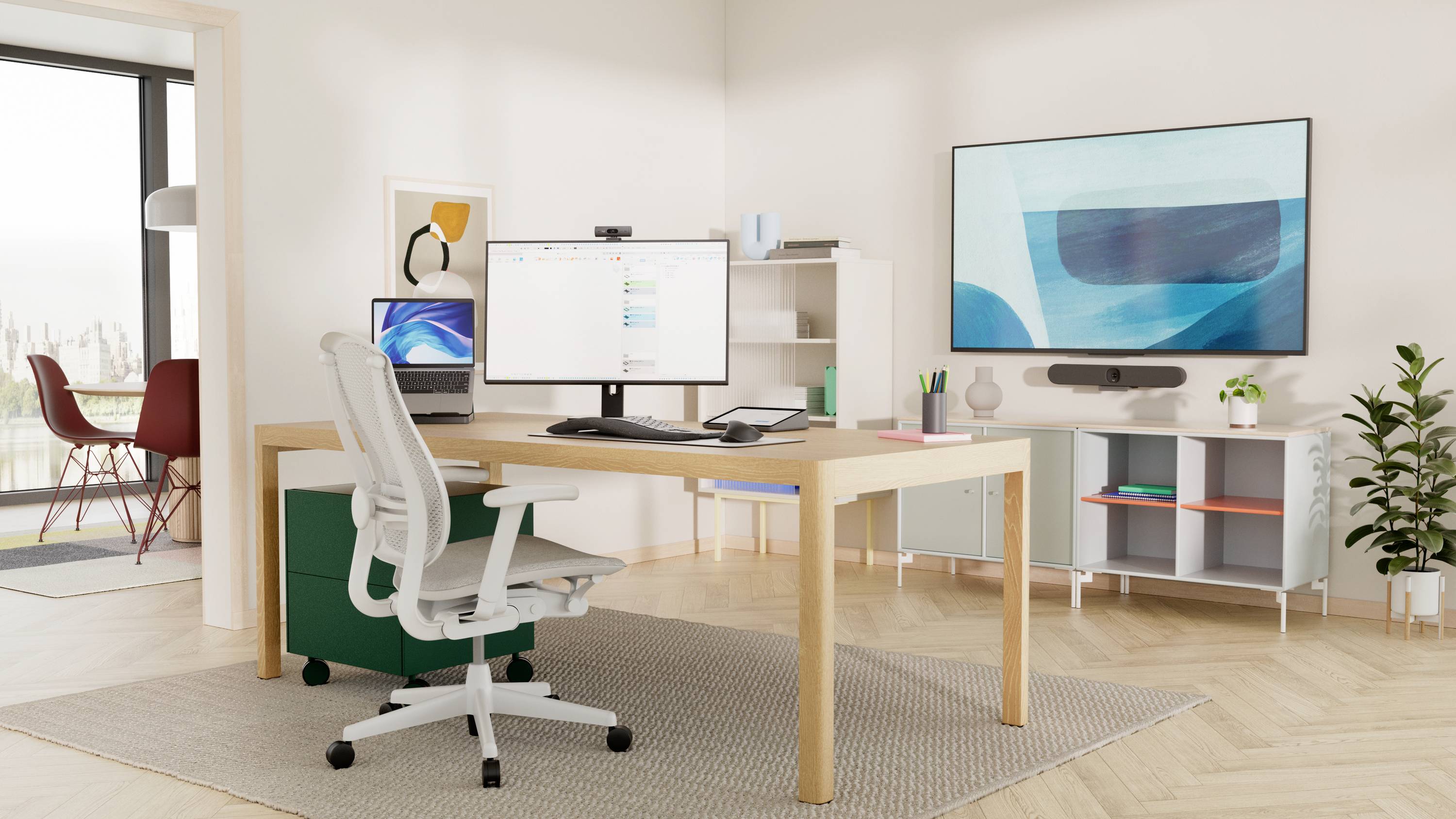 Bright, modern office with a desk, chair, screen and shelves. Large windows allow daylight to flood in; contemporary artwork adorns the walls.