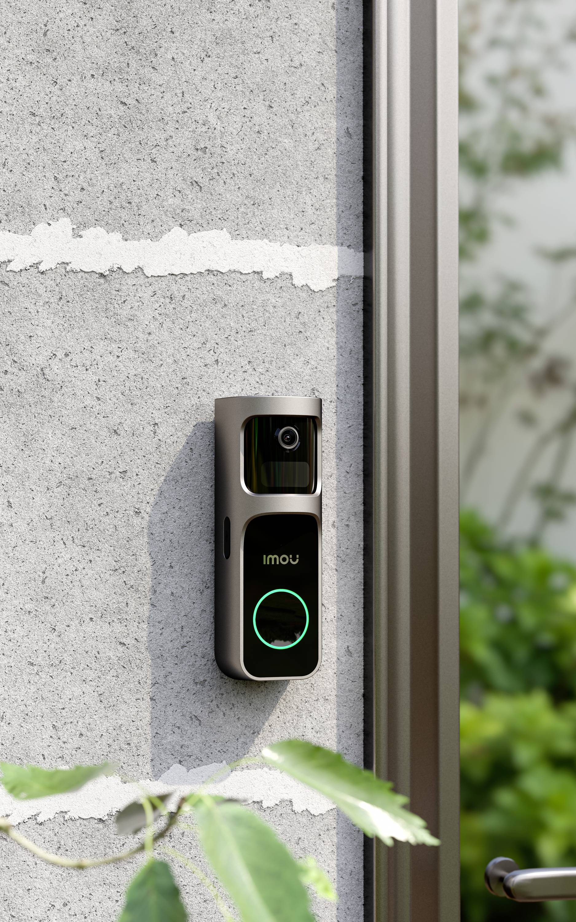 A modern video doorbell is mounted on a concrete wall beside a door, with a visible camera module and an illuminated doorbell button.