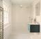 Modern bathroom with shower enclosure, floating washbasin and large window. Minimalist design with light-coloured tiles.
