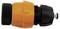 A black and orange plastic garden hose connector lies horizontally.