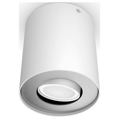 White cylindrical ceiling light with integrated speaker in the centre of the room.