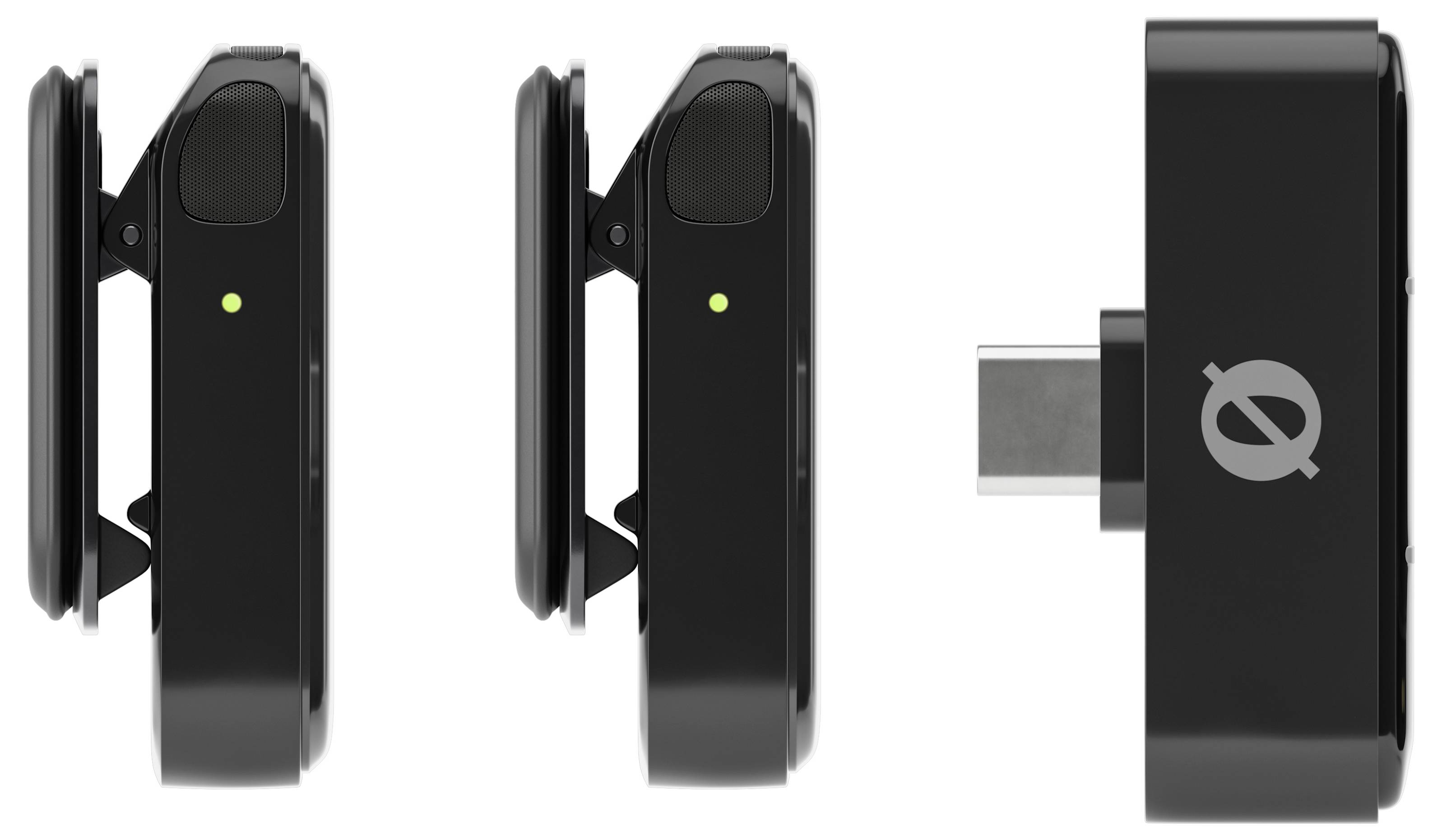 Two black wireless microphones and a USB-C receiver in a row. Microphones displaying green light indicate operational readiness.