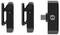 Two black wireless microphones and a USB-C receiver in a row. Microphones displaying green light indicate operational readiness.