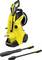 Pressure washer with a yellow casing and accessories. Suitable for intensive cleaning work outdoors.