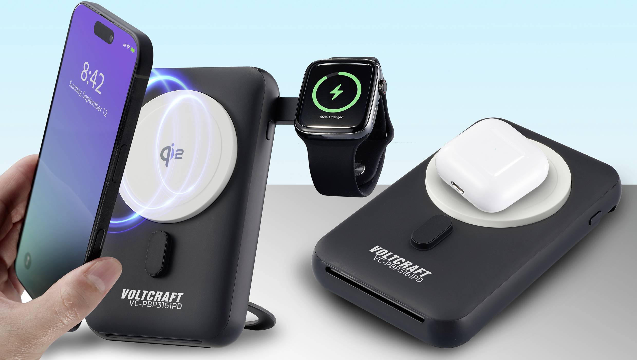 A smartphone, a smartwatch and a wireless headset are being charged simultaneously on a wireless charging pad.