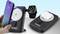 A smartphone, a smartwatch and a wireless headset are being charged simultaneously on a wireless charging pad.