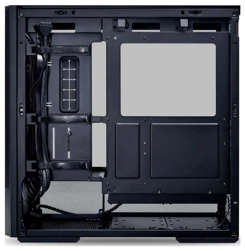 An open computer chassis without components, showing cable management spaces and mounting bays on a metal backplate.