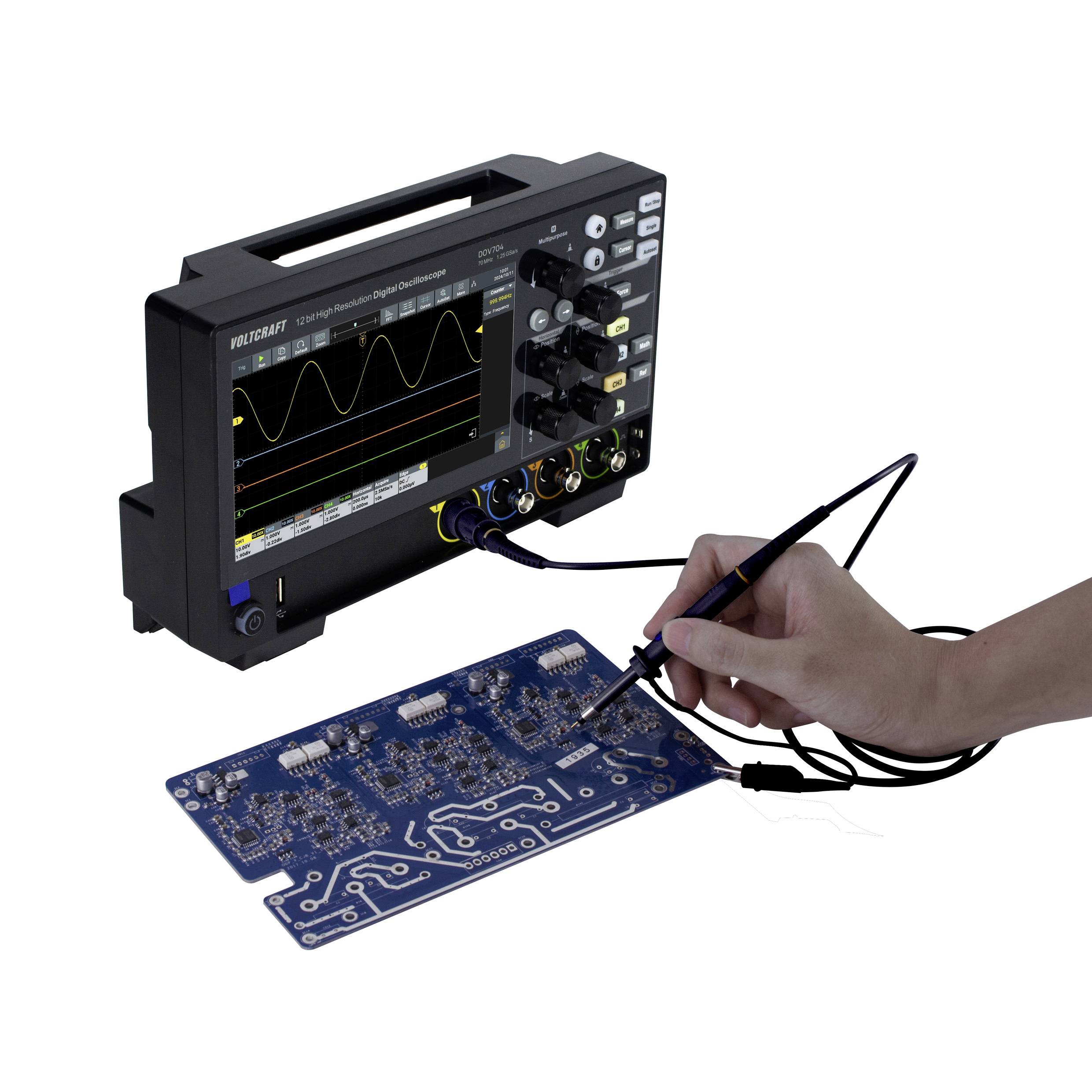 A person is measuring an electrical circuit with an oscilloscope, showing waveform and data on the screen. Motherboard in the foreground.