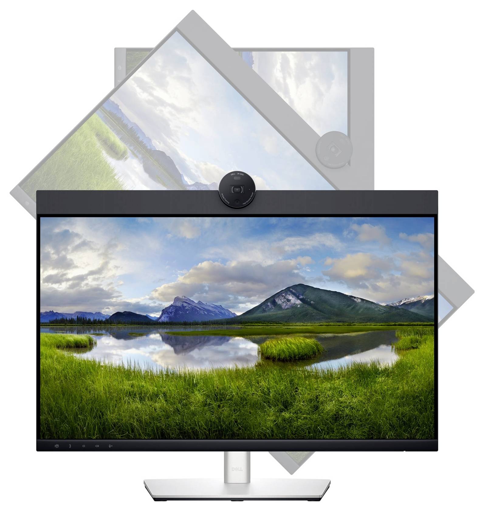 A computer monitor displays a landscape with mountains, a lake and green meadows beneath a cloudy sky.