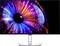 A monitor displaying a vivid image of a colourful patterned circle, reminiscent of an eye, depicted in luminous blue and red hues.
