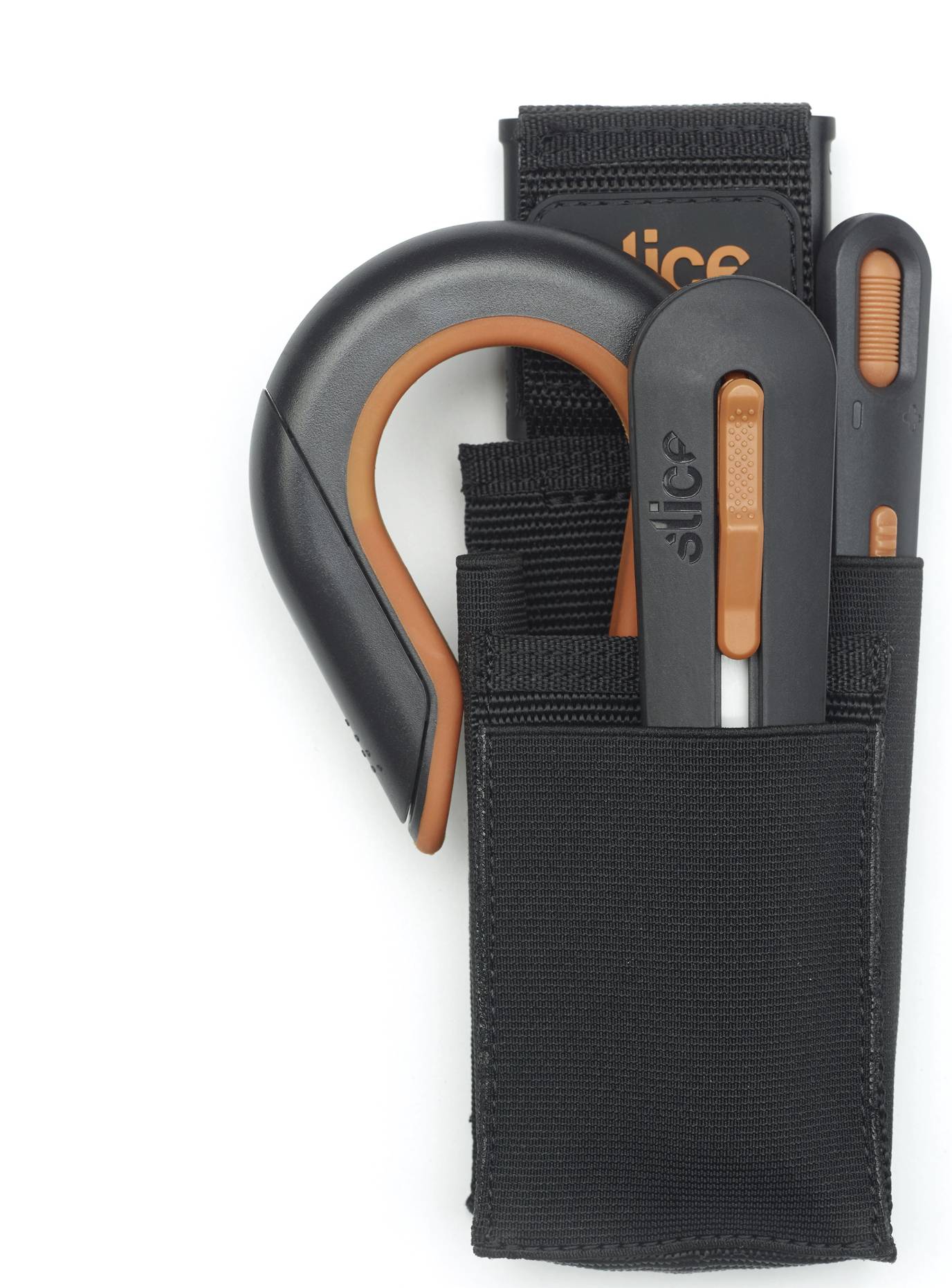 Three safety knives with black handles and orange accents in a black holder. The knives are of different shapes.