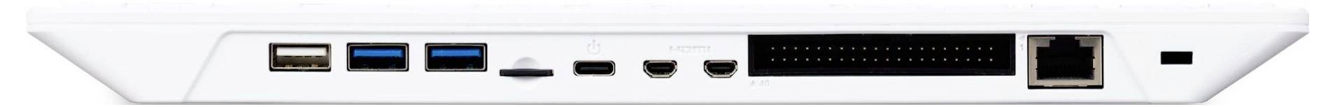 Back of an electronic device with various ports: USB, HDMI, Ethernet and more, arranged in a row.