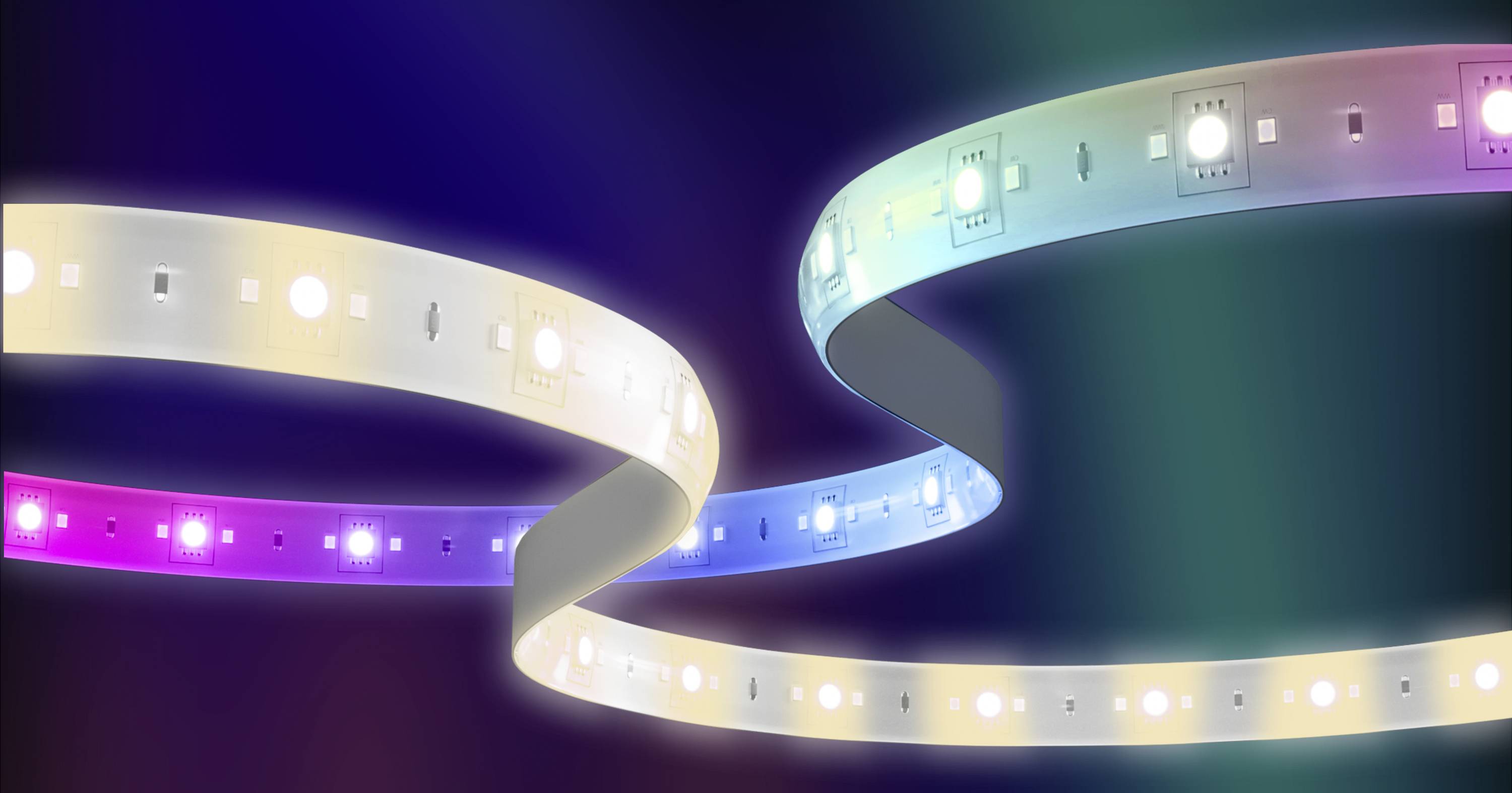 Two illuminating LED strips in various colours curve elegantly in a dark room, creating an atmospheric light.