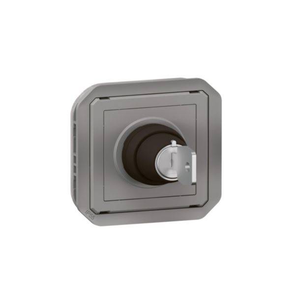 A grey square switch with a rotary handle in the centre, depicted from a slight side angle.