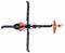 Plastic toy helicopter in black and white with red accents, viewed from above. Main and tail rotors visible.