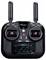 A black remote control with two aerials and control sticks. The display shows settings for the mode and frequency.