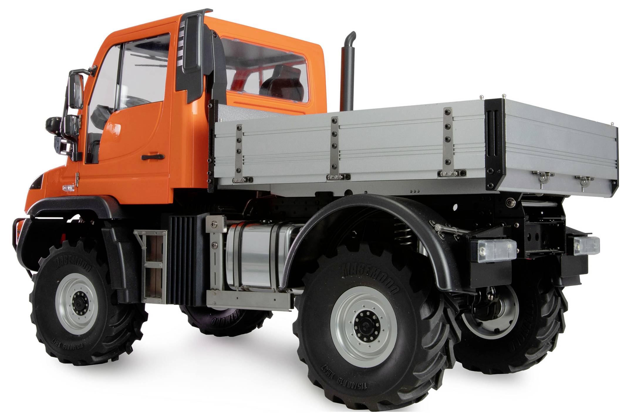 Orange lorry with a large cargo area, robust tyres, and an elevated driver's cab, suitable for heavy off-road operations.