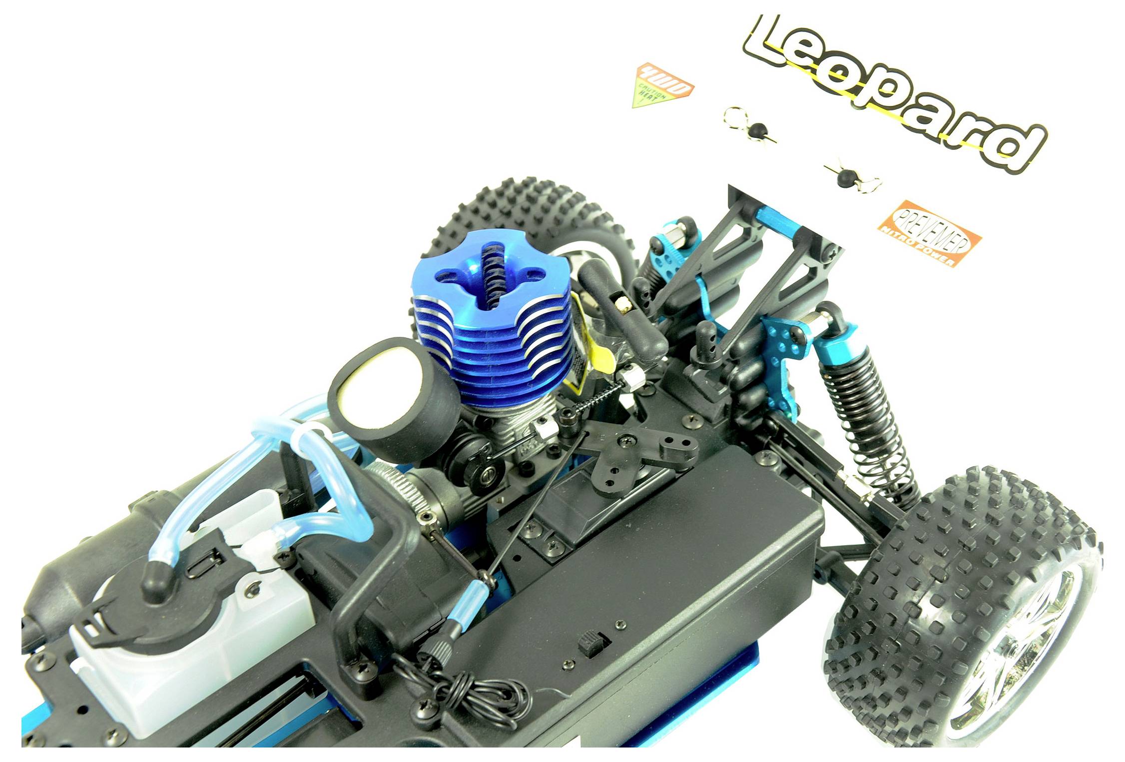 Remote-controlled car model in close-up, showing engine and suspension with blue, black and yellow design and large tyres.