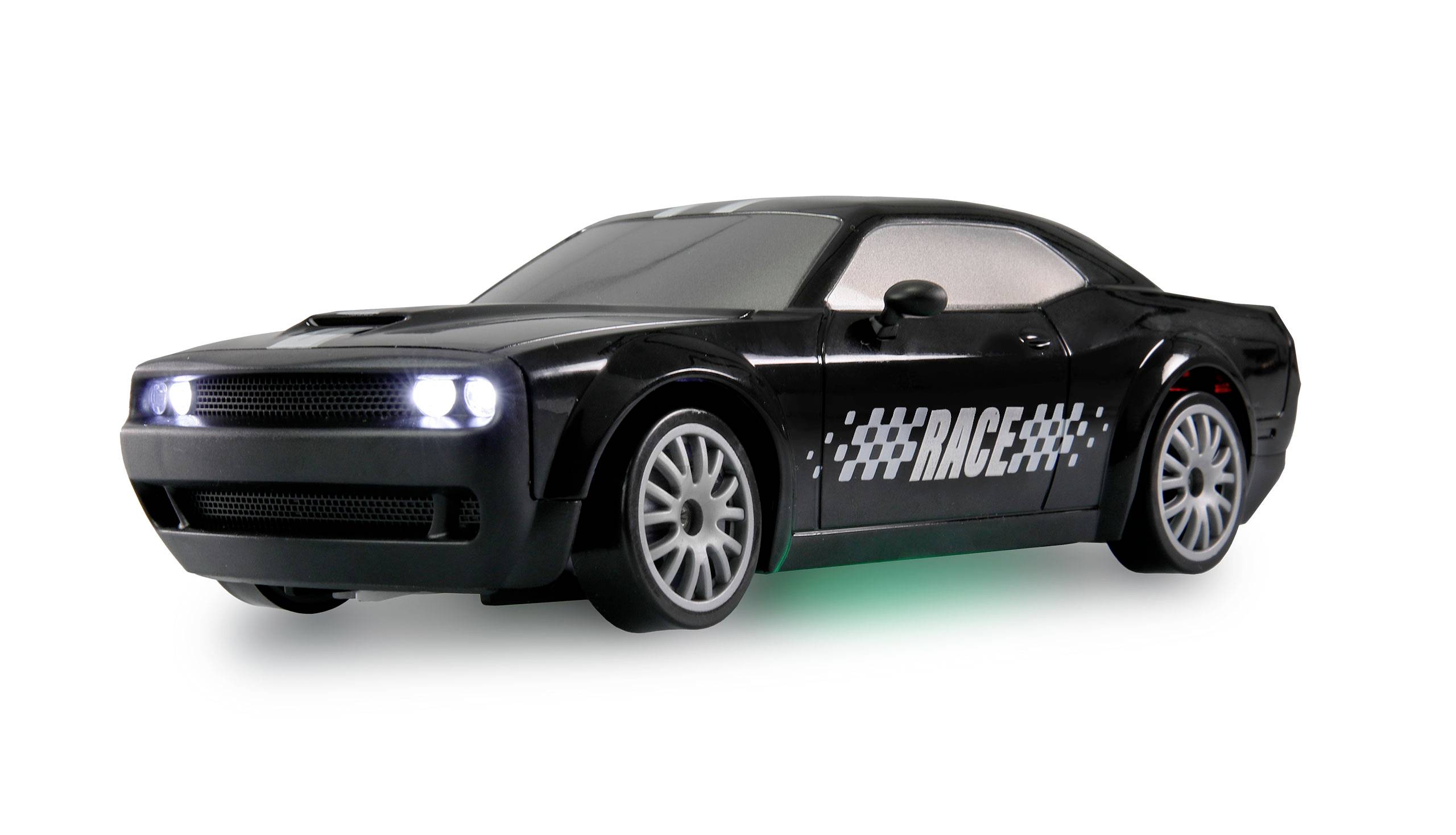Black toy racing car with illuminated headlights and 'RACE' written on the side.