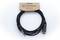 A black audio cable by Cordial with a 6.3 mm jack plug and socket, packaged in a cardboard holder bearing the inscription 'Cordial elements'.