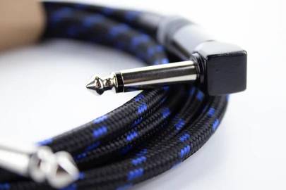 A black, braided audio cable with blue accents and metal plugs. Perfect for music devices to transmit clear sound.