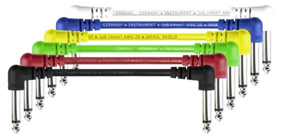 Six colourful angled jack cables in white, yellow, blue, green, red and black, arranged in a staggered formation.