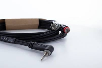 Black audio cable with a 3.5mm jack plug and two RCA plugs (red and white) on a white background.