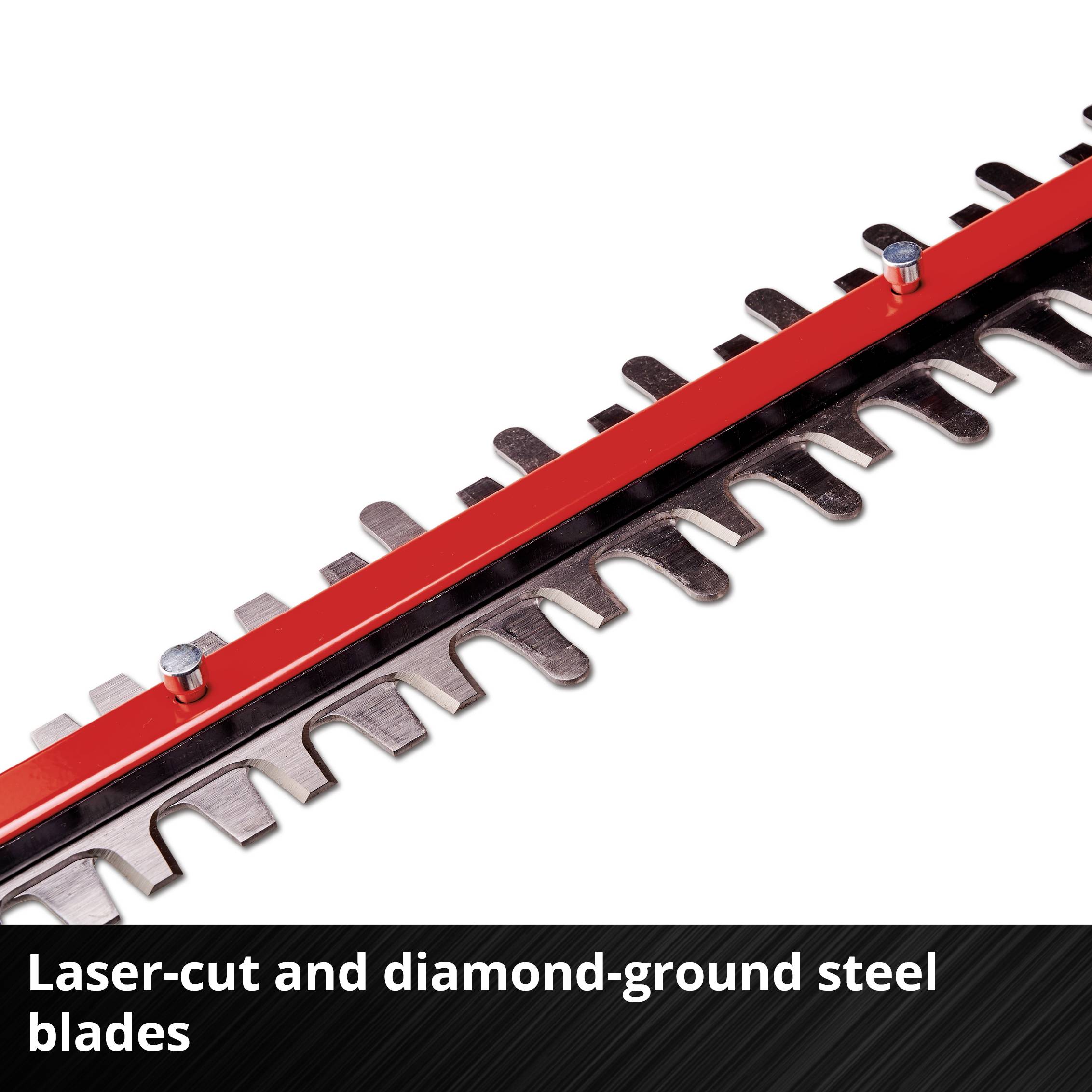 Close-up of a red serrated knife blade, made from laser-cut and diamond-ground steel.