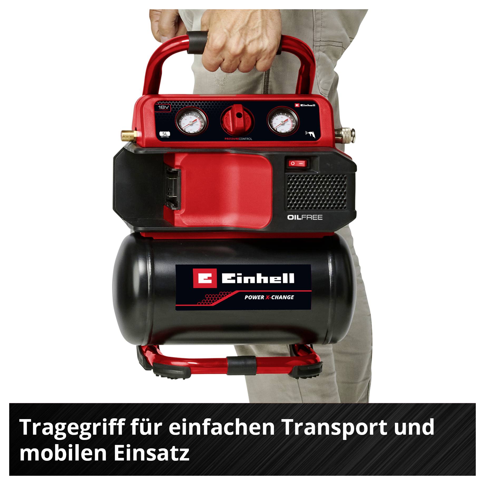 A person is carrying a red portable Einhell oil-free compressor with a carrying handle; underneath it states 'Carrying handle for easy transport and mobile use'.