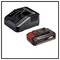 Battery charger and battery set for power tools, black, with red and white details. Battery has a capacity of 2.5 Ah at 18 V.