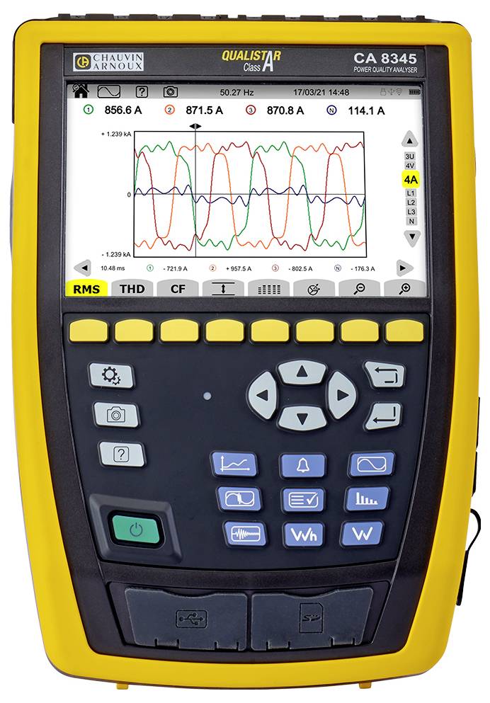 Yellow multimeter displaying electrical waveforms on the screen, including voltages in amperes. Control keypad present.