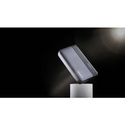 A power bank with the inscription '100W' sits at an angle on a plinth against a dark background.