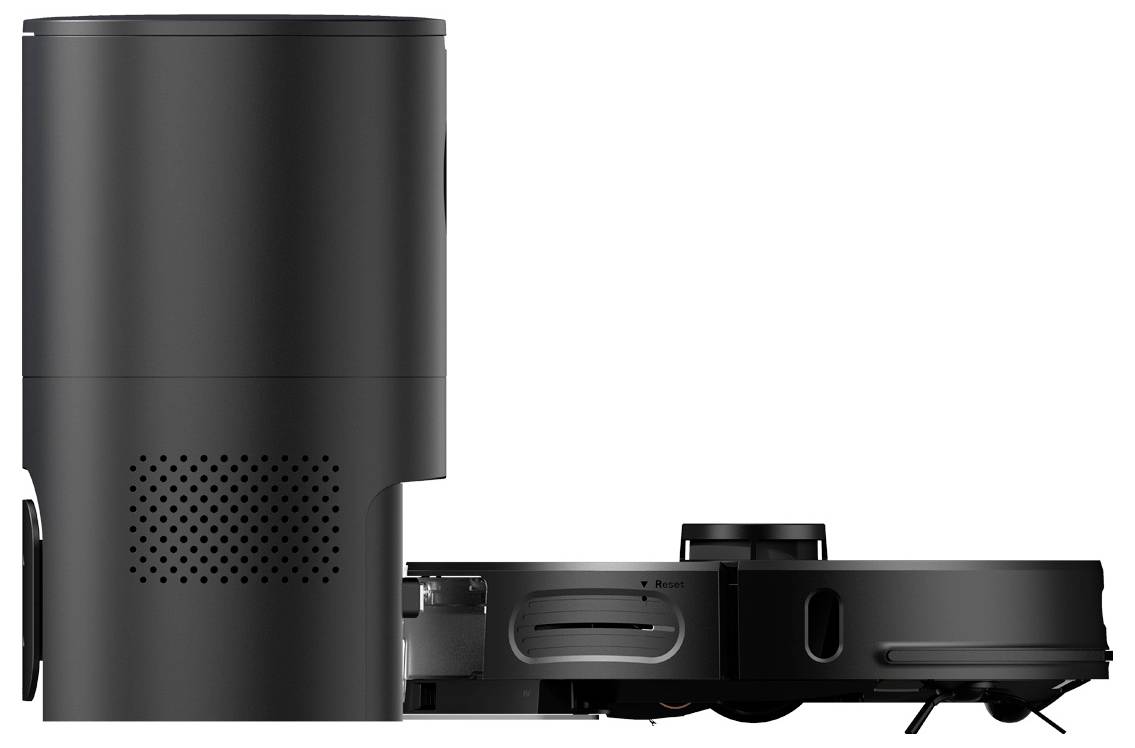 A black robot vacuum cleaner with charging station, shown from the side. The robot has a round sensor on its top surface.