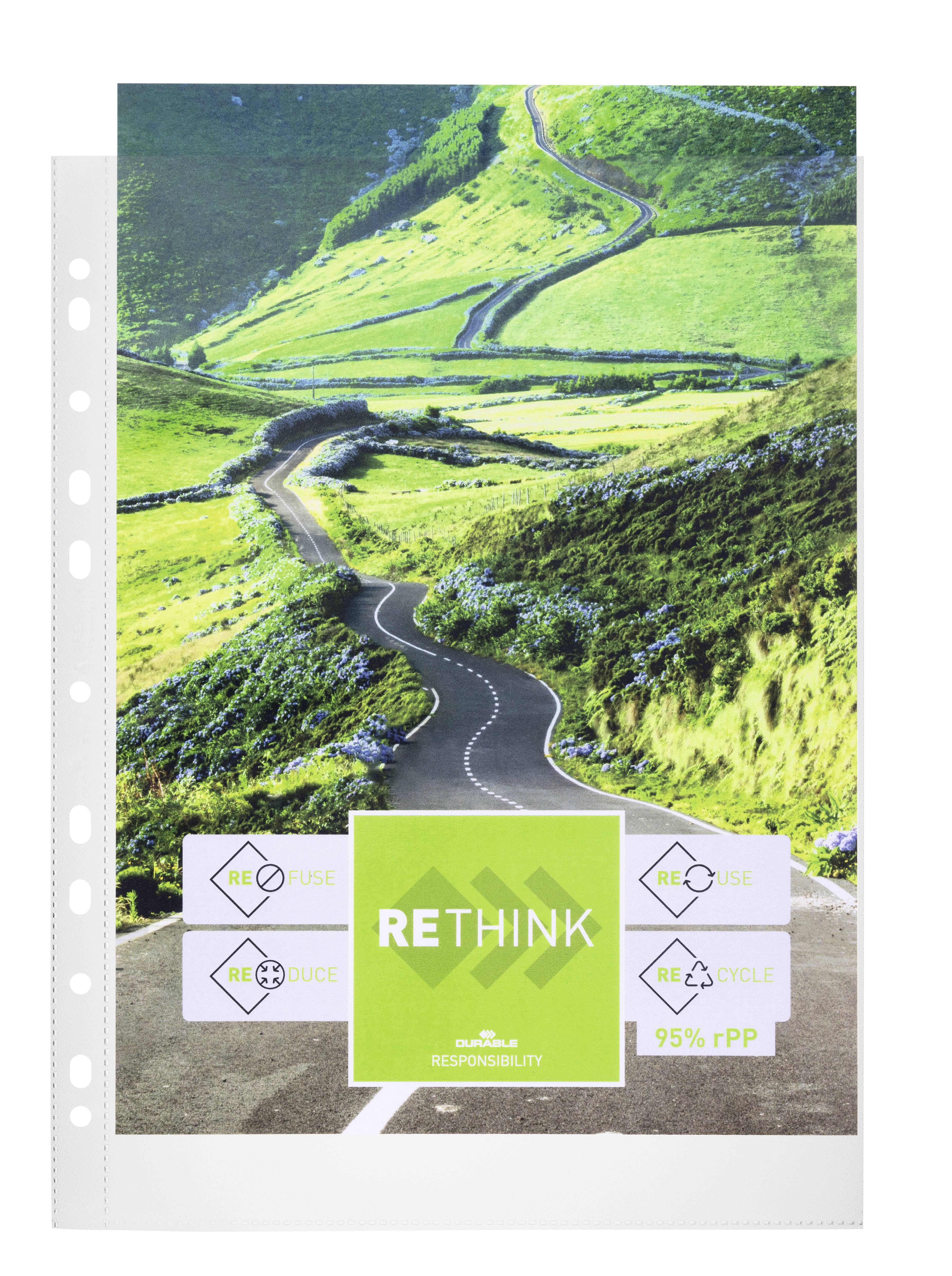 A winding road through green hills. Text below: 'RETHINK'. Symbols: Reduce, Reuse, Recycle. 95% recycled material.