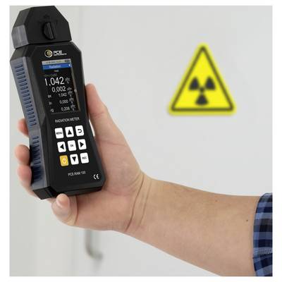 Hand holding a radiation meter showing a high reading, with a radiation warning symbol in the background.<br>