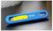 A blue, rectangular sliding switch with a yellow toggle, positioned on a grey surface. It is labelled 'PHC'.