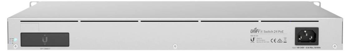 A network device in a silver-coloured rack enclosure with ventilation slots at the front and a black power switch on the right.