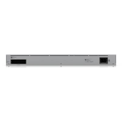 Back of an electronic device with numerous ports and a power connection. Manufacturer information printed.