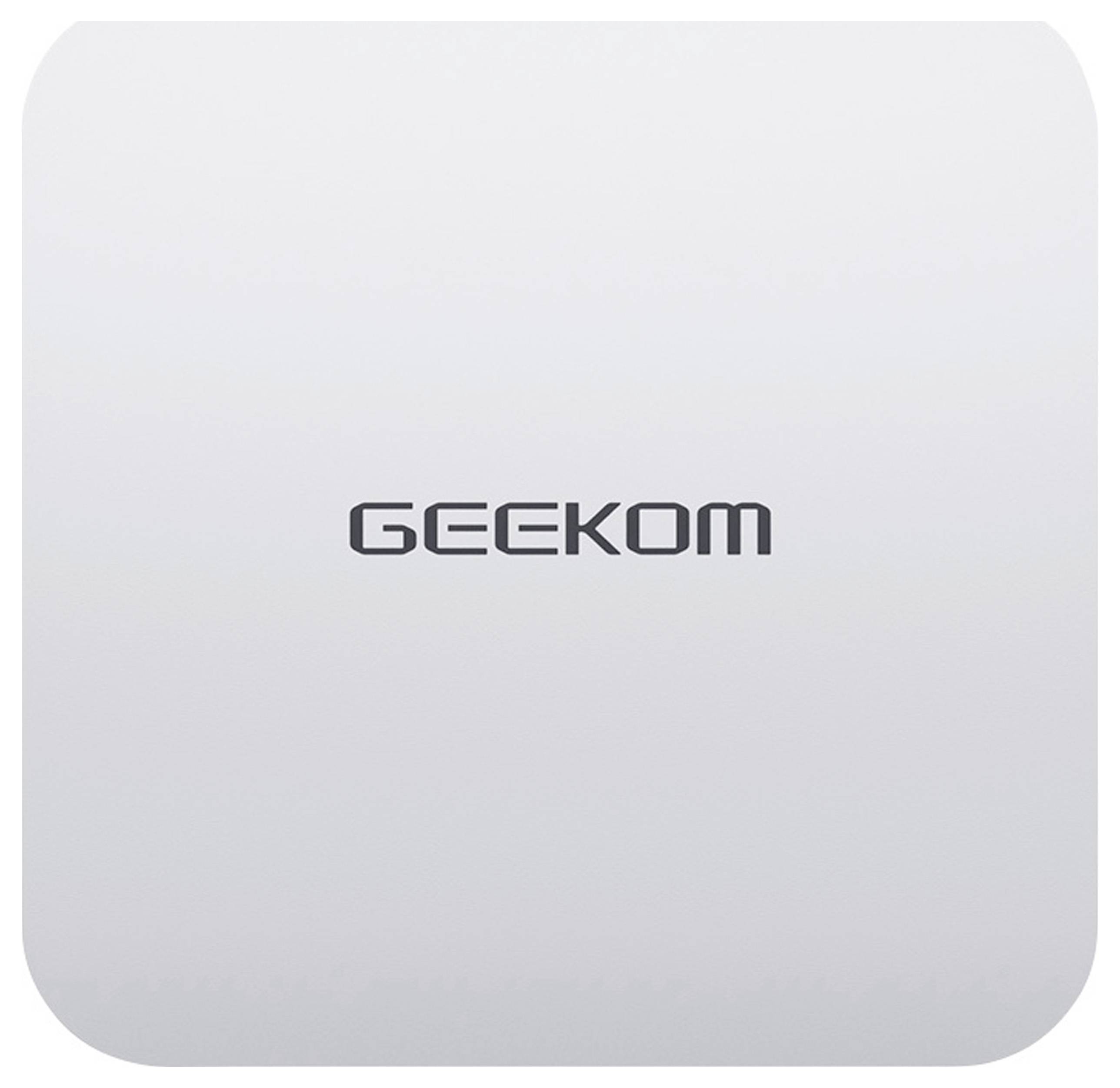 A white device with rounded corners and the inscription 'GEEKOM' in the centre.