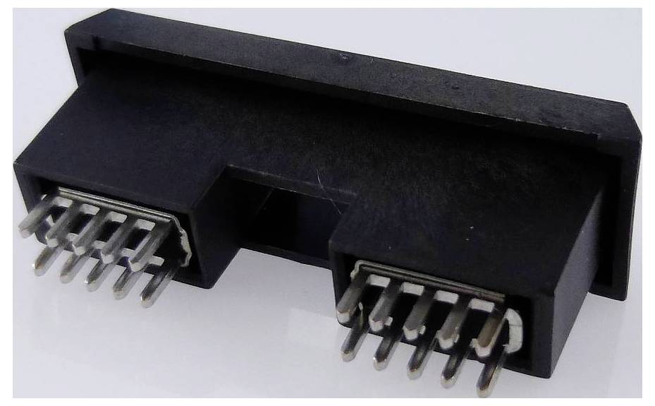 A black electrical connector with two rows of pins arranged symmetrically.