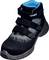 Black safety shoe with three hook and loop fasteners and blue internal padding. 'uvex' printed on the side.