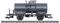A black tanker wagon of Deutsche Bahn is standing on a section of railway track. The wagon has markings with technical specifications.