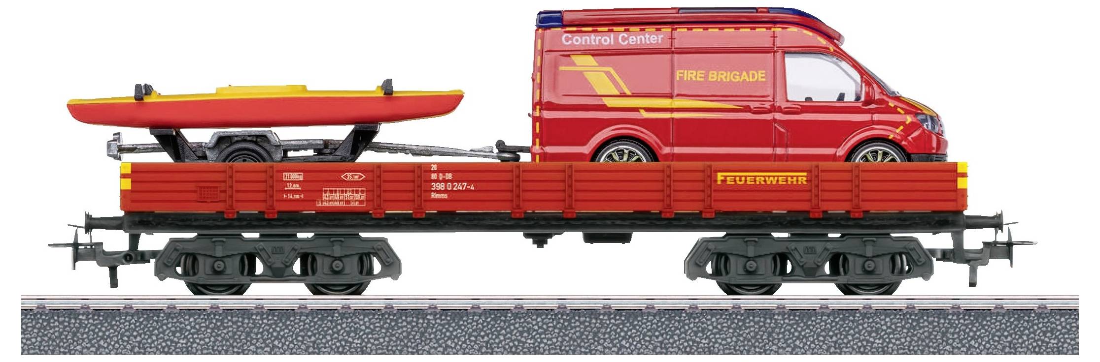 A red fire engine with a yellow inflatable boat is standing on a flat railway wagon.
