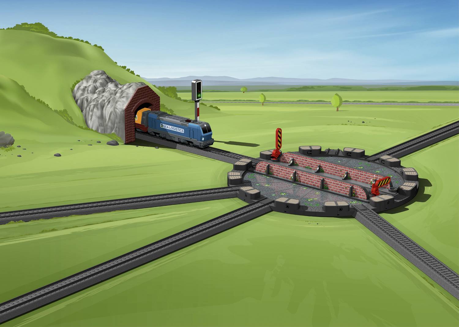 A blue train emerges from a tunnel and approaches a circular turnstile, surrounded by several railway tracks, in a green landscape.