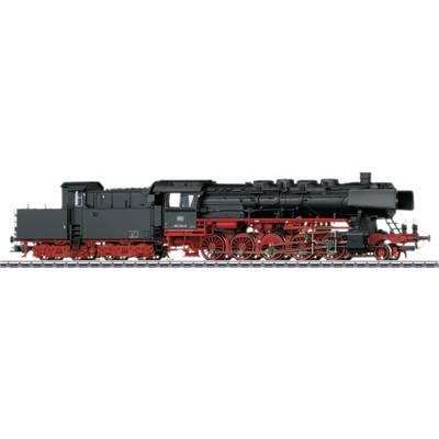 Black steam locomotive with red wheels and chassis on railway tracks, side view. Historic model with detailed construction.
