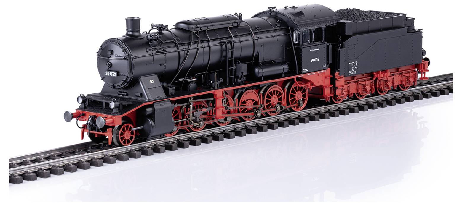 A model of a black steam locomotive with red wheels on a railway track, intricately detailed.