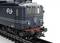 Dark blue locomotive of the Dutch Railways on a track. Distinctive logo and red-black front details visible.
