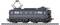 A dark blue electric train locomotive with round windows and black wheels stands on the tracks, marked with a white logo.
